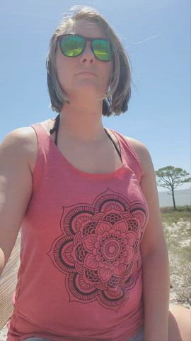 Flashing my pierced tits on the beach