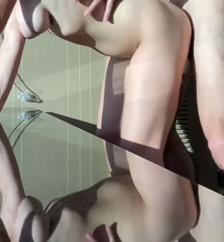 Cumming in front of the hotel window