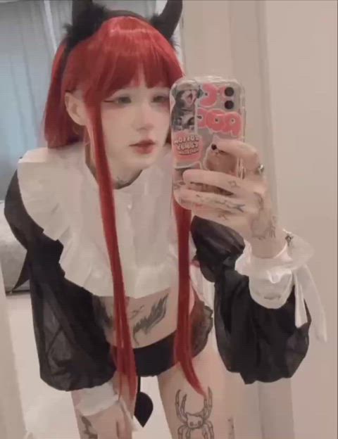 Who is this tattooed beauty?