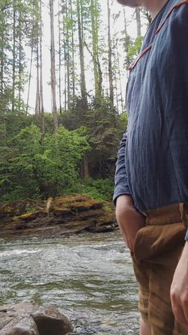 Stripping by the river in the rain