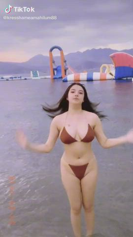 Cutie dancing outside on the beach