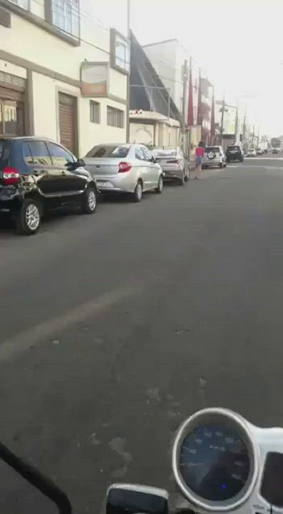 Woman walking on the street is shot by men on a motorcycle