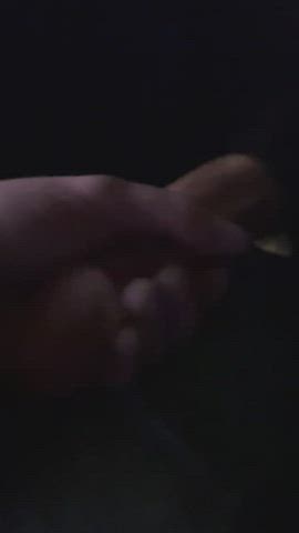 Stroking a thick cock at the gloryhole