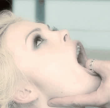 Holding her mouth open
