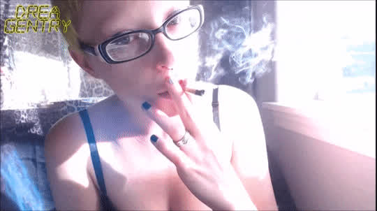 blue eyes brazilian cleavage glasses goth short hair smile smoking gif