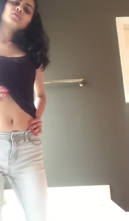 Cute girl wetting her jeans