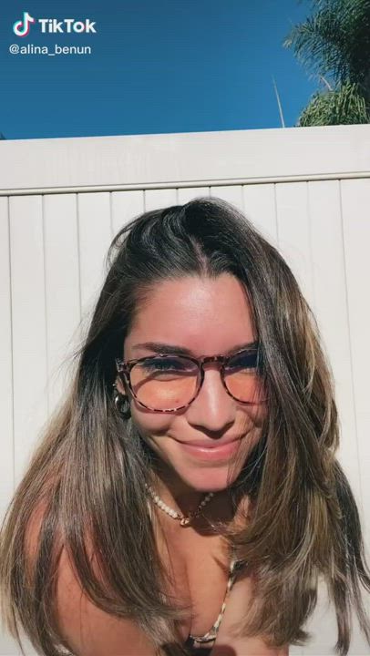 Squishing her tits