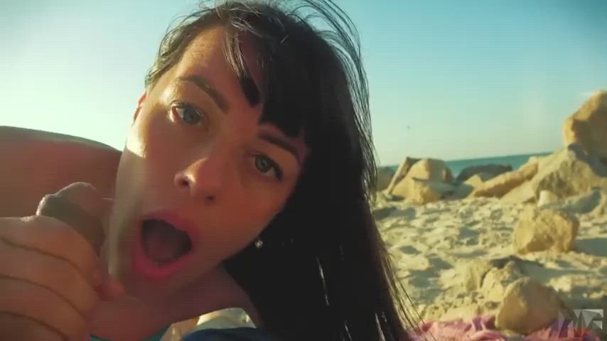 thick facial on a public beach