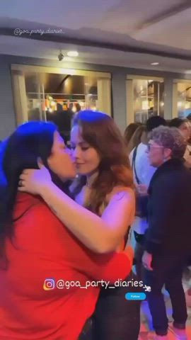 The age gap doesn't matter for these two women. Hooking up in front of everyone at