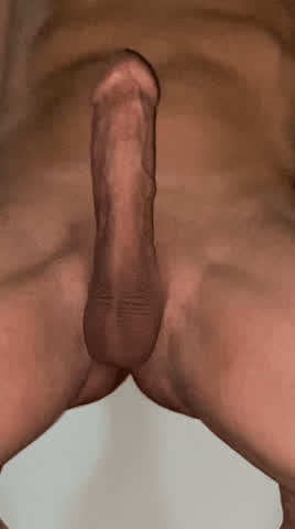 Fit and tan shaved cock cums hands-free after edging