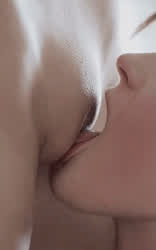 Lesbian sensual lick of shaved pussy