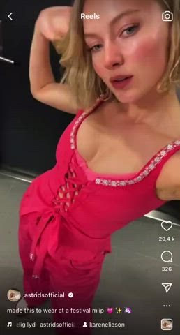 Astrid S showing off her cleavage in a pink bra