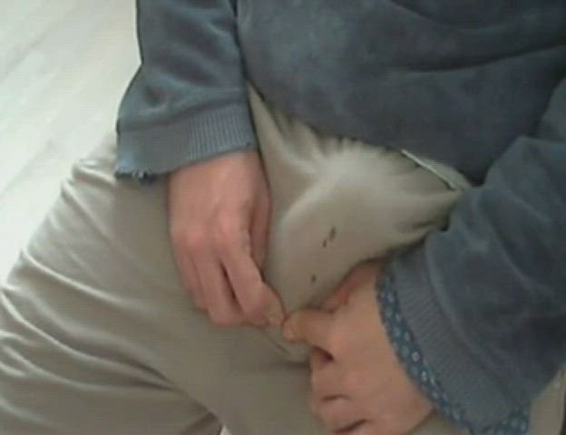 His wet spot grows and grows as he moans, unable to stop it from happening