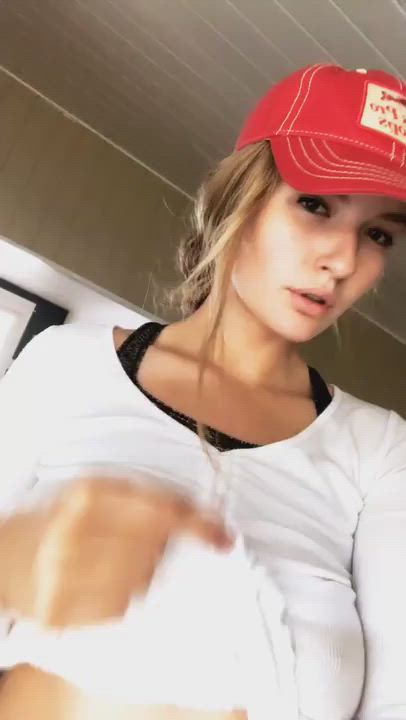 Releasing her natural breasts