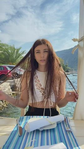 Dropping her panties in a seaside restaurant [GIF]