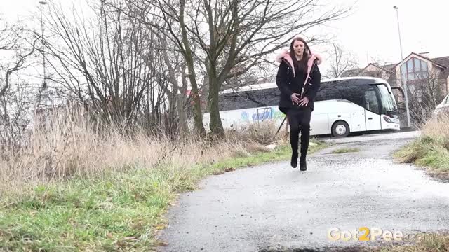 Katy pulls up her dress to relieve her piss desperation - Watch the full scene at