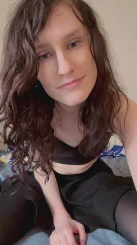 In a skirt and thigh highs