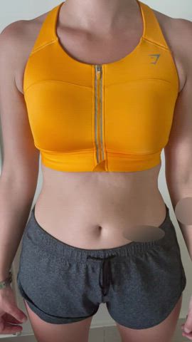 Taking my sports bra off after a sweaty workout!