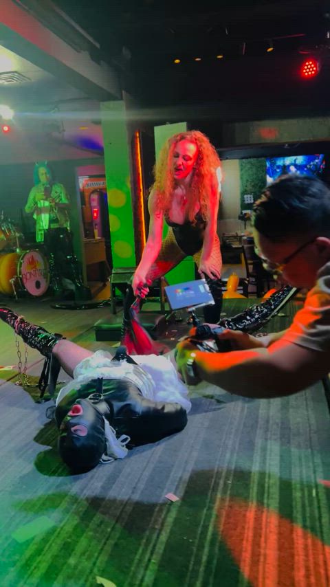 Goth event flogging in latex